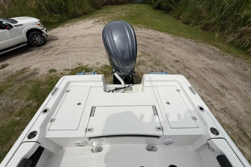 Slide: The Image of 2026 Tidewater 2300 Carolina Bay boat with outboard motor on trailer. - 23