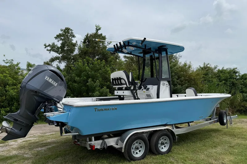 Slide: The Image of 2026 Tidewater 2300 Carolina Bay boat with Yamaha engine on trailer, parked outdoors. - 7