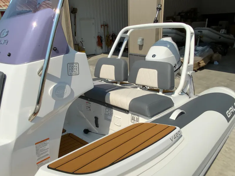 Slide: The Image of Gala V420 boat, 2026 model, featuring cushioned seating and fiberglass construction in a sunlit setting. - 10