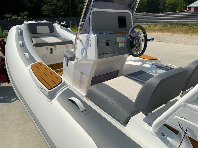 Slide: The Image of 2026 Gala V420 boat interior with steering wheel, seating, and control panel in sunlight. - 3