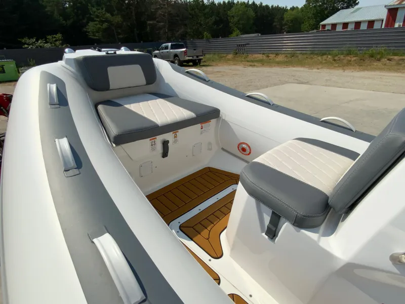 Slide: The Image of 2026 Gala V420 boat interior with cushioned seats and wooden flooring. - 5