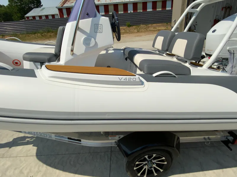 Slide: The Image of 2026 Gala V420 boat with sleek design and comfortable seating on a trailer. - 6