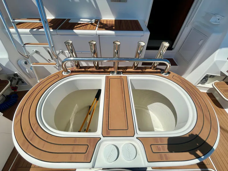 Slide: The Image of Fishing station on 1998 Viking 50 Convertible yacht with rod holders and dual sinks. - 11