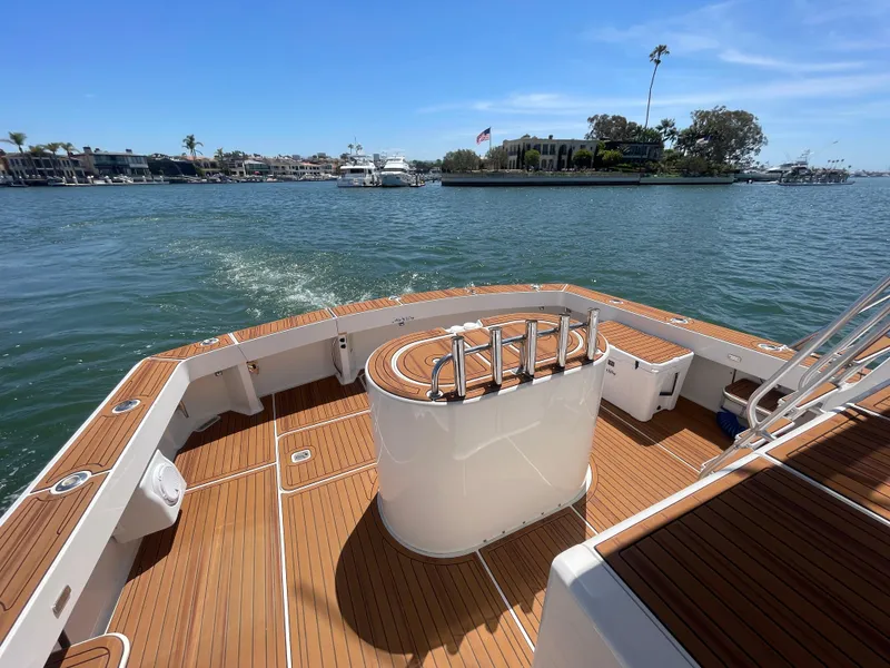 Slide: The Image of 1998 Viking 50 Convertible yacht with teak deck, cruising on a sunny day. - 12