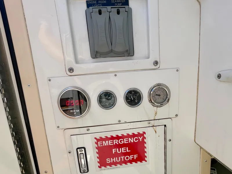 Slide: The Image of Control panel of a 1998 Viking 50 Convertible boat with emergency fuel shutoff. - 16