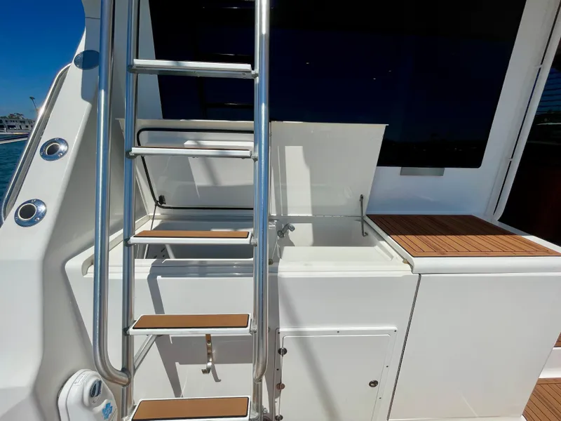 Slide: The Image of Stainless steel ladder and sink on 1998 Viking 50 Convertible yacht deck. - 19