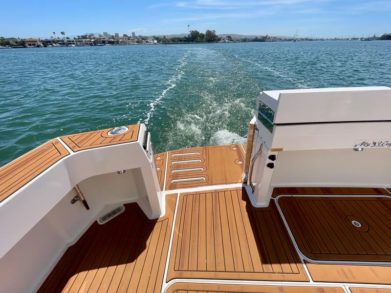 Slide: The Image of 1998 Viking 50 Convertible yacht with teak deck, cruising on a sunny day. - 21