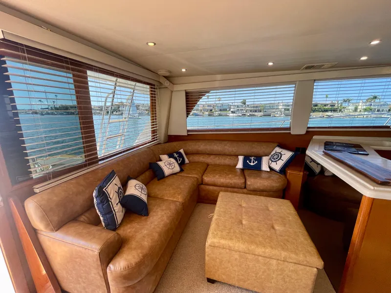 Slide: The Image of Luxurious interior of 1998 Viking 50 Convertible yacht with leather seating and nautical decor. - 30