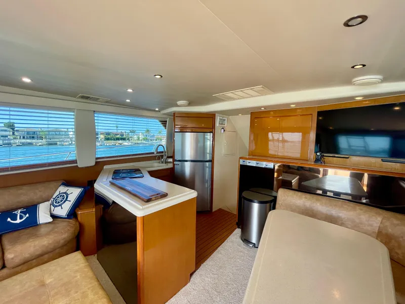 Slide: The Image of Interior of 1998 Viking 50 Convertible yacht with modern kitchen and seating area. - 31