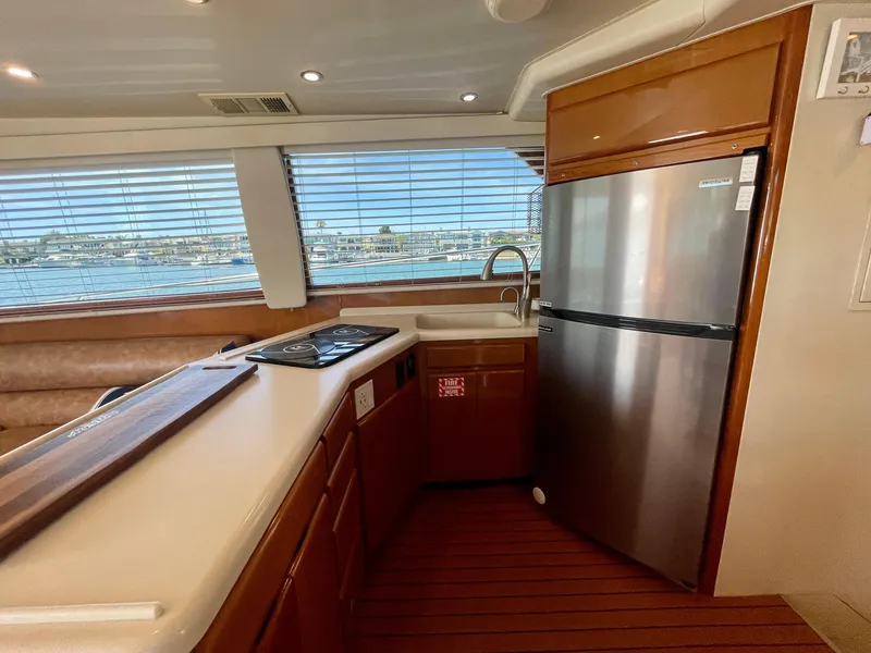 Slide: The Image of Luxurious kitchen interior of 1998 Viking 50 Convertible yacht with modern appliances. - 33