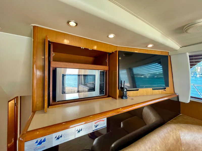 Slide: The Image of Interior of 1998 Viking 50 Convertible yacht with microwave and TV. - 37