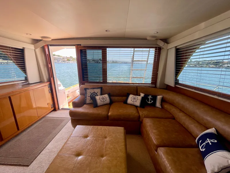 Slide: The Image of Luxurious interior of 1998 Viking 50 Convertible yacht with leather seating and nautical decor. - 40