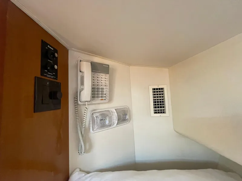 Slide: The Image of Interior of 1998 Viking 50 Convertible yacht with phone, control panel, and vent. - 42