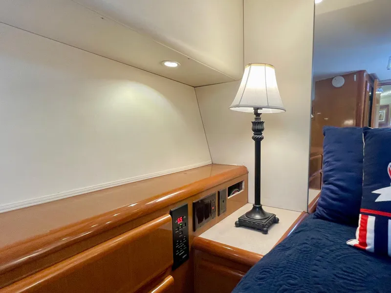 Slide: The Image of Interior of 1998 Viking 50 Convertible yacht with lamp and blue cushions. - 46