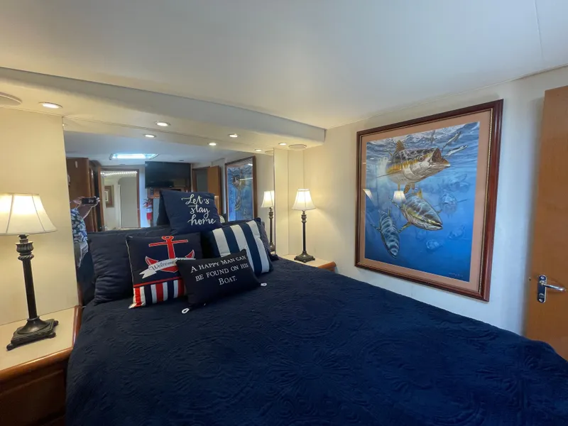 Slide: The Image of Cozy bedroom in 1998 Viking 50 Convertible yacht with nautical decor and marine artwork. - 48