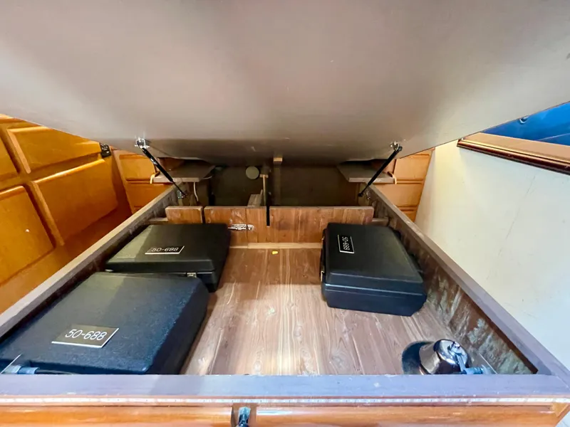 Slide: The Image of Open storage compartment in 1998 Viking 50 Convertible boat, showcasing interior details. - 49