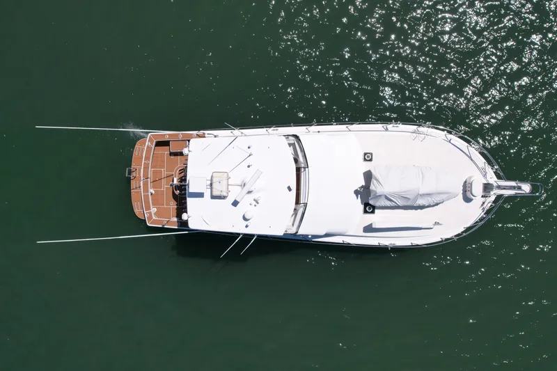 Slide: The Image of Overhead view of 1998 Viking 50 Convertible yacht on water. - 6