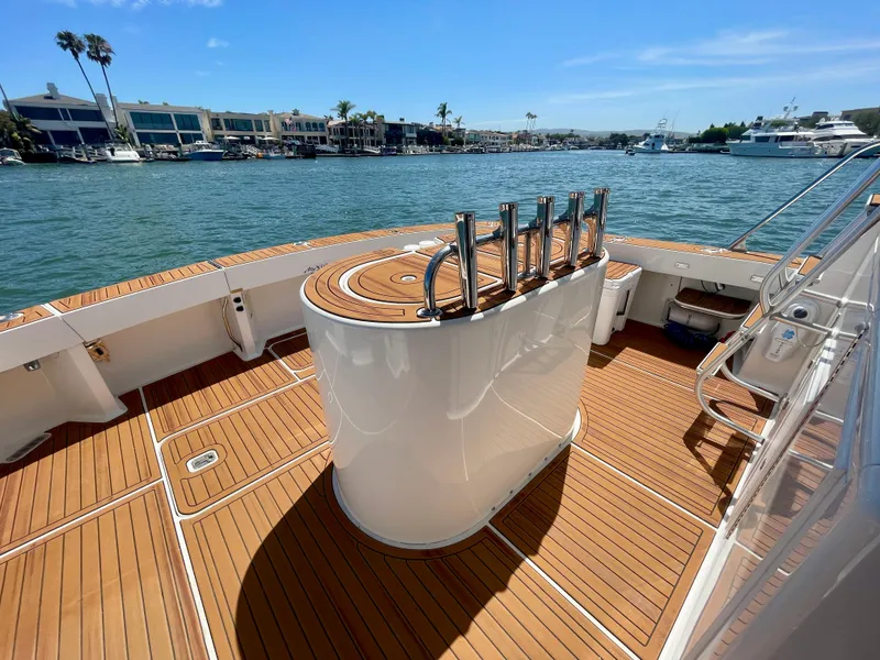 Slide: The Image of Luxurious 1998 Viking 50 Convertible yacht deck with teak flooring and ocean view. - 9