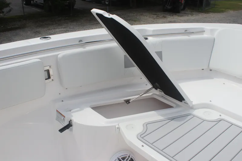 Slide: The Image of 2026 Sea Fox 288 Commander boat with open storage compartment and cushioned seating. - 12
