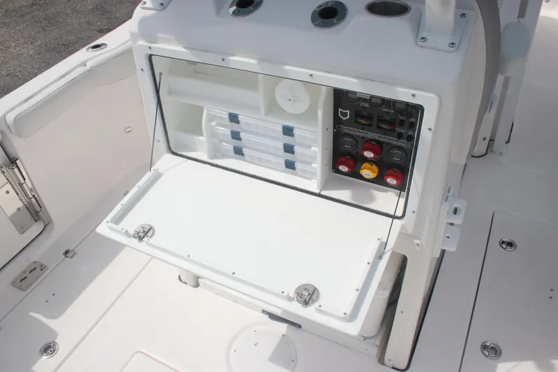 Slide: The Image of 2026 Sea Fox 288 Commander boat console with storage and control panel. - 15