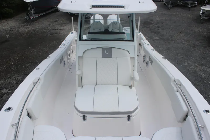 Slide: The Image of 2026 Sea Fox 288 Commander boat interior with white seating and sleek design. - 19