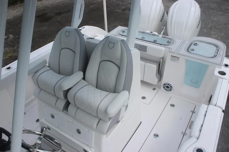 Slide: The Image of 2026 Sea Fox 288 Commander boat interior with dual cushioned seats and Yamaha engines. - 21
