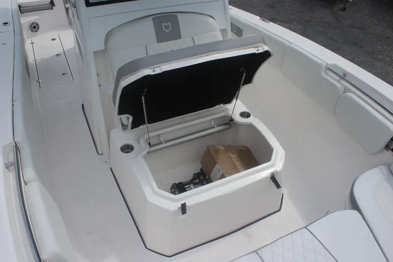 Slide: The Image of 2026 Sea Fox 288 Commander boat with open storage compartment and seating area. - 24