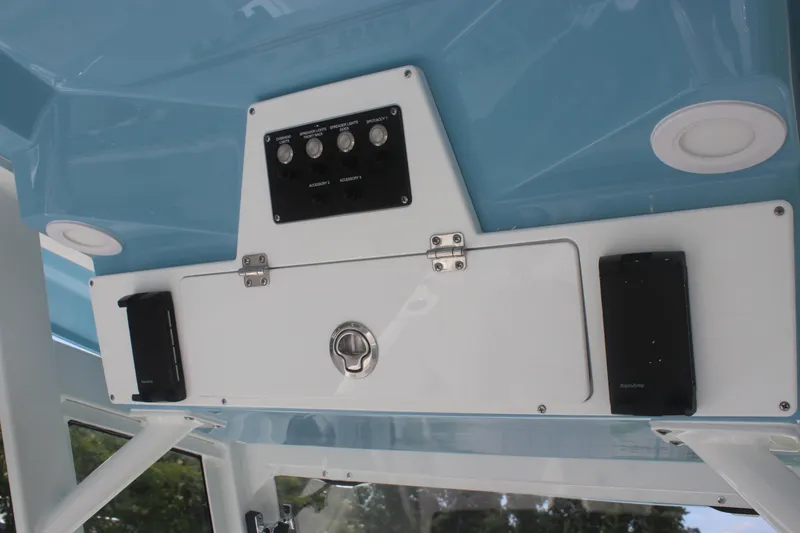 Slide: The Image of Control panel of 2026 Sea Fox 288 Commander boat with switches and storage compartment. - 28
