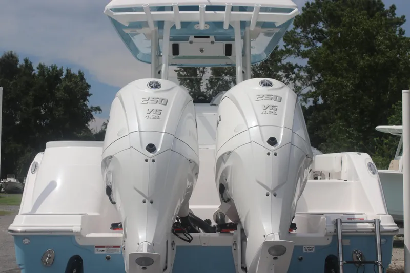 Slide: The Image of 2026 Sea Fox 288 Commander with twin Yamaha 250 V6 engines, rear view. - 7