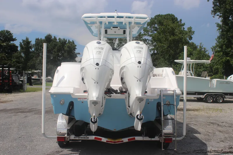 Slide: The Image of 2026 Sea Fox 288 Commander boat with dual outboard engines on a trailer. - 9