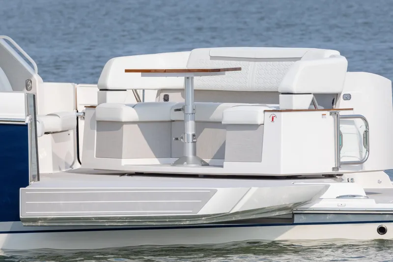 Slide: The Image of 2025 Tiara Yachts 43 LE with elegant seating and table on deck. - 18