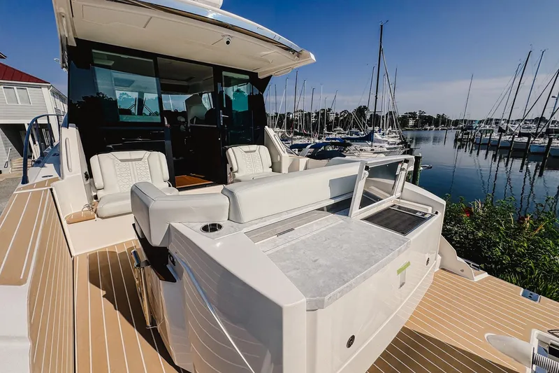 Slide: The Image of 2026 Tiara Yachts 43 LE luxury yacht interior with marina view. - 7