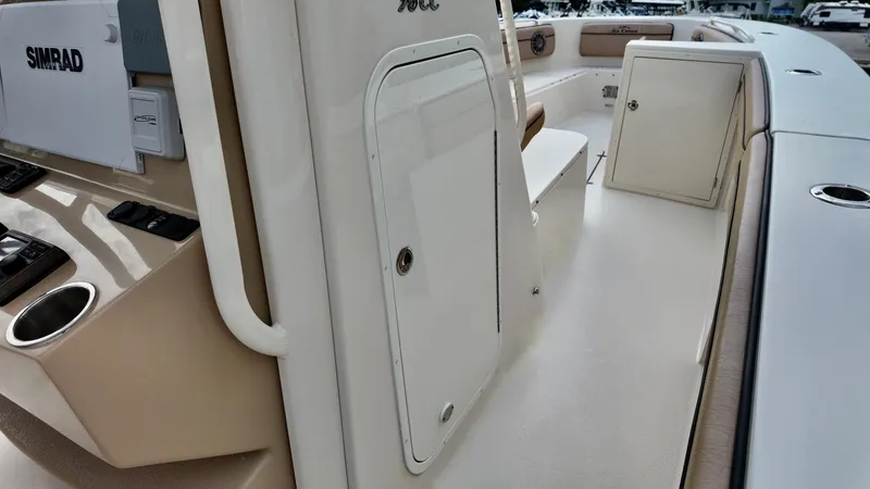 Slide: The Image of 2024 Sea Chaser 35 HFC Bluewater Series boat interior with storage compartments and seating. - 10