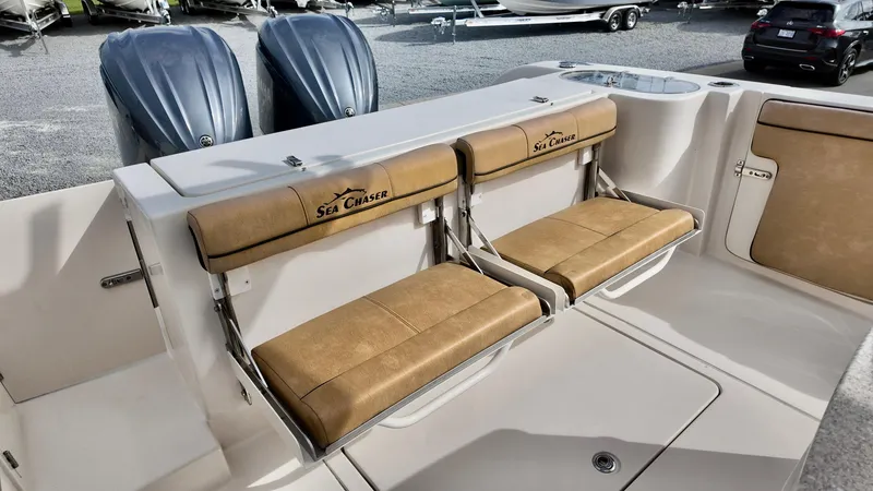 Slide: The Image of 2024 Sea Chaser 35 HFC Bluewater Series boat with tan seating and dual engines. - 13