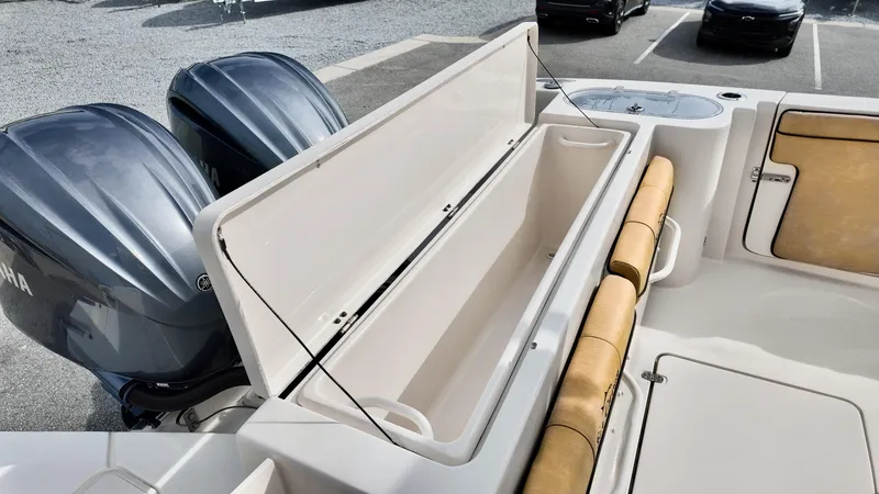 Slide: The Image of 2024 Sea Chaser 35 HFC Bluewater Series boat with open storage compartment and twin Yamaha engines. - 14