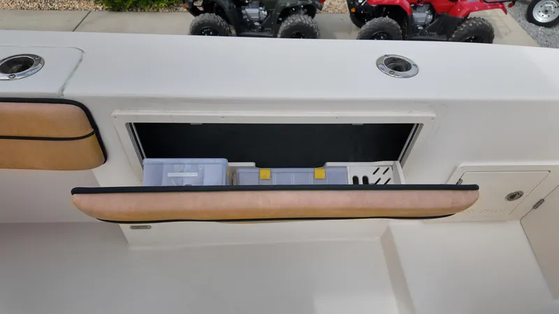 Slide: The Image of 2024 Sea Chaser 35 HFC Bluewater Series boat storage compartment with tackle boxes. - 17