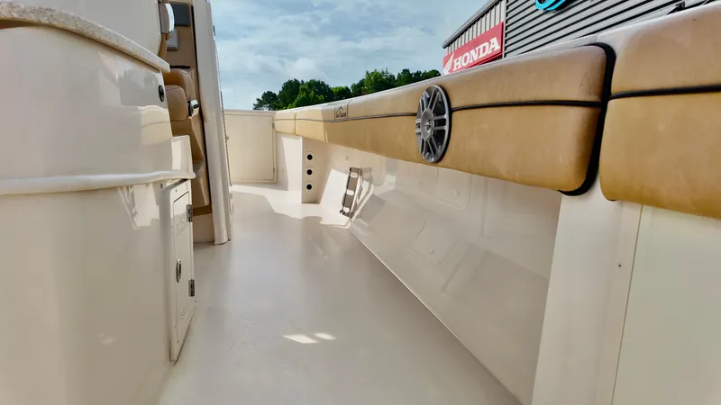 Slide: The Image of 2024 Sea Chaser 35 HFC Bluewater Series boat interior with tan seating and speaker. - 19