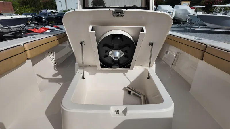 Slide: The Image of 2024 Sea Chaser 35 HFC Bluewater Series boat with open storage compartment. - 21