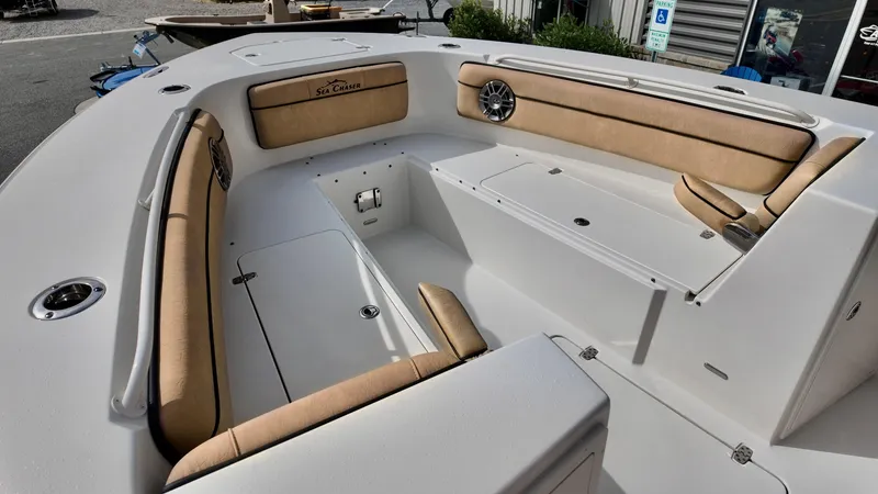Slide: The Image of 2024 Sea Chaser 35 HFC Bluewater Series boat interior with tan seating and storage compartments. - 25