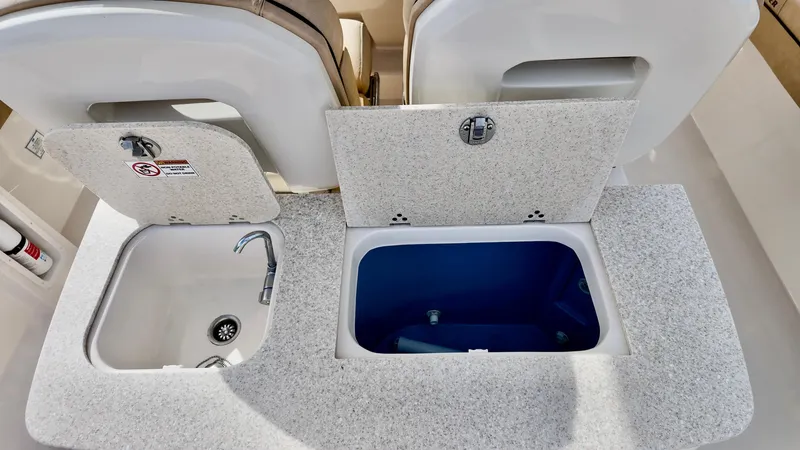 Slide: The Image of 2024 Sea Chaser 35 HFC Bluewater Series boat sink and storage compartments. - 29