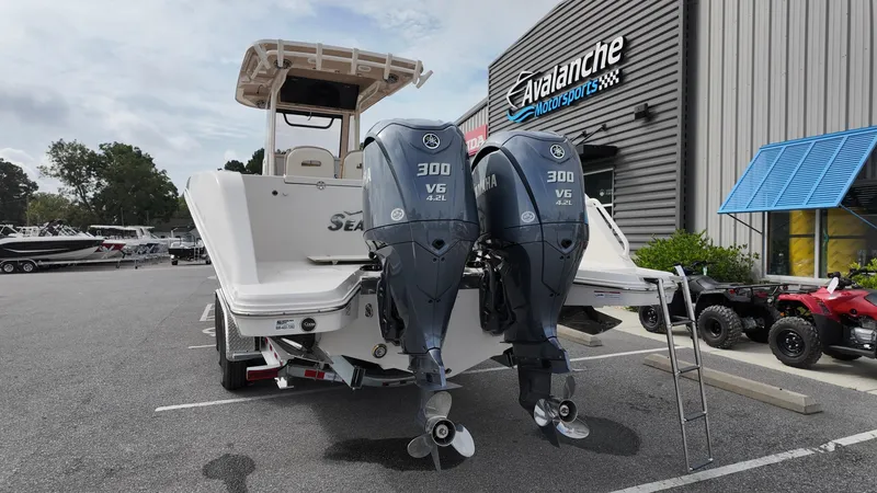 Slide: The Image of 2024 Sea Chaser 35 HFC Bluewater Series boat with dual Yamaha 300 V6 engines at dealership. - 3