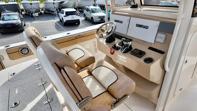 Slide: The Image of 2024 Sea Chaser 35 HFC Bluewater Series boat interior with Simrad electronics and luxury seating. - 31