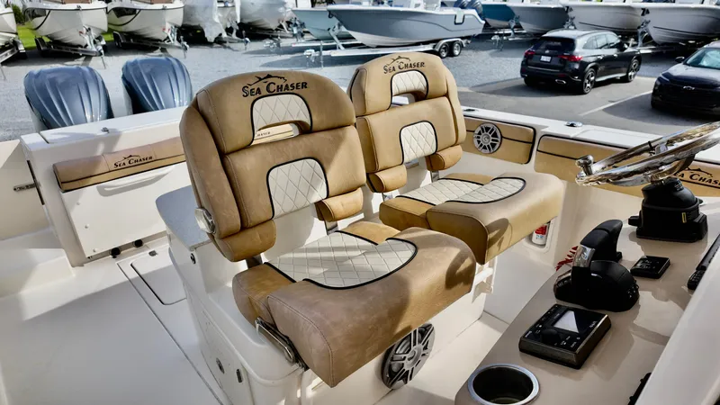 Slide: The Image of 2024 Sea Chaser 35 HFC Bluewater Series boat interior with luxurious seating and controls. - 32