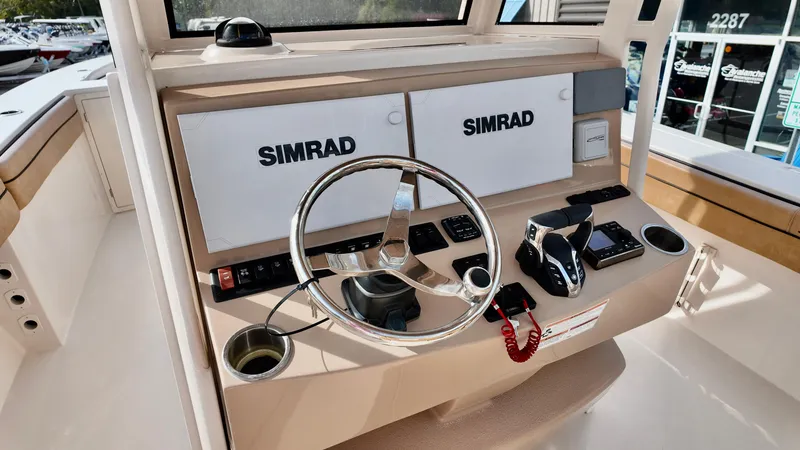 Slide: The Image of 2024 Sea Chaser 35 HFC Bluewater Series helm with Simrad electronics and steering wheel. - 33