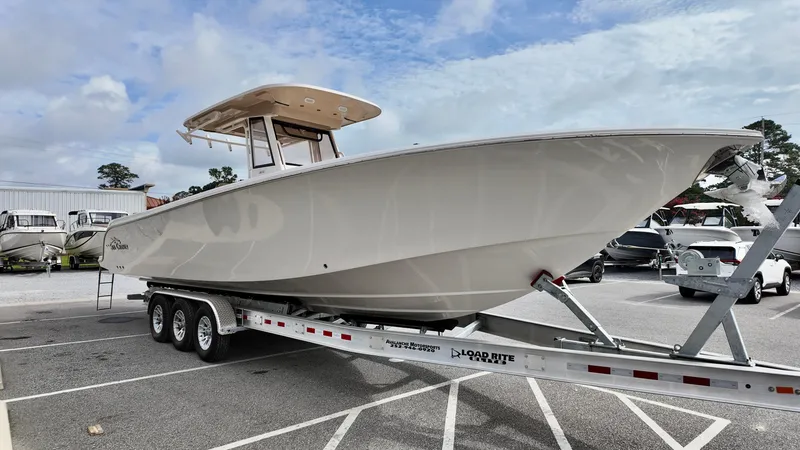 Slide: The Image of 2024 Sea Chaser 35 HFC Bluewater Series boat on trailer in parking lot. - 4