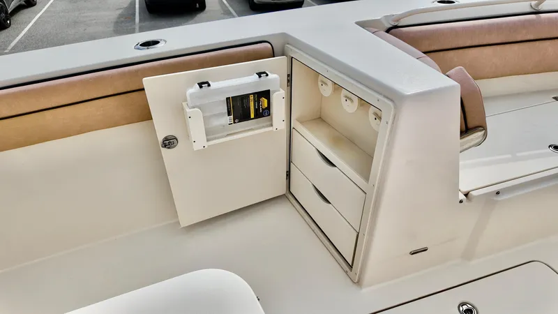 Slide: The Image of 2024 Sea Chaser 35 HFC Bluewater Series boat interior with storage compartments and seating. - 7