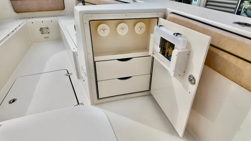 Slide: The Image of 2024 Sea Chaser 35 HFC Bluewater Series boat storage compartment with drawers and utility access. - 8