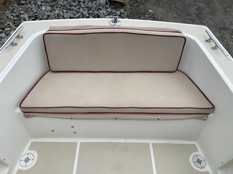 Slide: The Image of Atlas Boat Works Pompano 21, 2003 model, beige cushioned seating with red trim. - 27