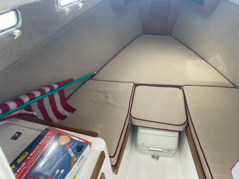 Slide: The Image of Interior of 2003 Atlas Boat Works Pompano 21 with cushioned seating and storage. - 35