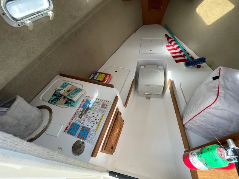 Slide: The Image of Interior of 2003 Atlas Boat Works Pompano 21 with storage and safety equipment. - 38